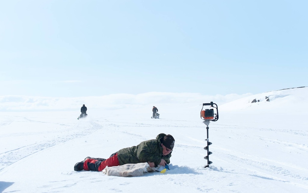 Arctic Adventure: Snowmobile Expedition and Ice Fishing